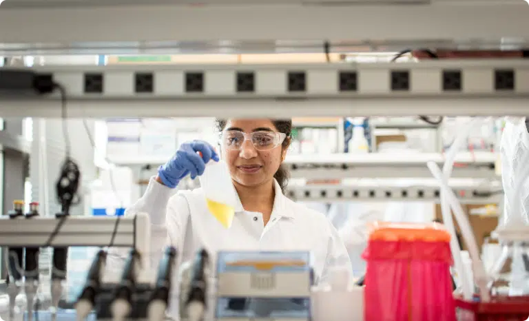 Arvinas scientific staff member conducting tests in lab